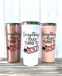 three different colored tumblers with sayings on them