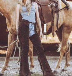 This Exquisite Leather & Suede Chaps Features a Striking Fringes & Non Fringes Style emblem, making it a perfect accessory for western wear, Cowgirl wear Equestrian ensembles. Crafted entirely by hand Made, this unique piece combines durability with style, ensuring it stands out at any occasion. Embrace your individuality with this versatile and eye-catching hat that seamlessly blends classic elegance with a rebellious Chap Chap Has Difference Sizes of Waist ,Inseam and Thigh if the Customer wan Fitted Western Brown Bottoms, Fitted Brown Western Bottoms, Cowgirl Chaps, Wild West Costumes, Cowboy Chaps, Western Chaps, Cowgirl Halloween, Riding Chaps, Fringe Pants