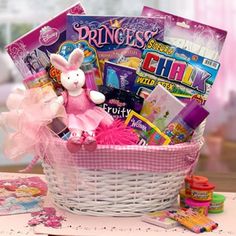 a pink basket filled with toys on top of a table