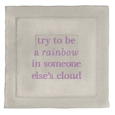 a white square with purple writing on it that says try to be a rainbow in someone else's cloud