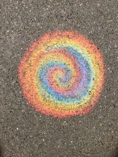 an image of a rainbow colored object on the ground that looks like it has been painted