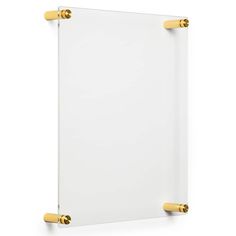 an empty white board with gold handles