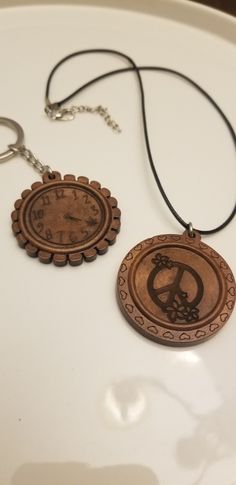 two wooden pendants sitting on top of a white table