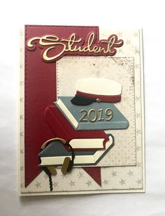 a card with some type of book and hat on it's cover that says student