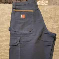 Wrangler Workwear Cargo Pants Ranger Relax Fit. Blue Denim Bottoms For Outdoor, Outdoor Denim Blue Cotton Bottoms, Outdoor Cotton Denim Blue Bottoms, Blue Jeans With Pockets For Outdoor, Outdoor Dark Wash Bottoms With Pockets, Colored Denim Jeans, Utility Jeans, Carhartt Work Pants, Hugo Boss Jeans