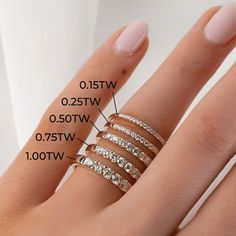 a woman's hand with three different rings on it and the measurements for each ring