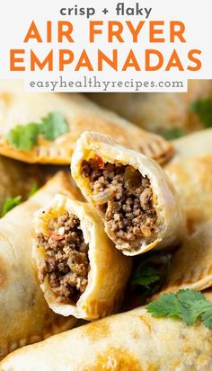 an air fryer empanada is cut in half and stacked on top of each other