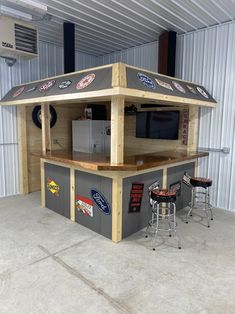 an outdoor bar made out of pallets in a garage