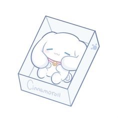 a small white cat sitting in a box with the word cinnamon on it's chest