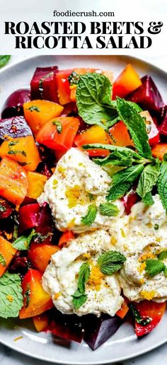 roasted beets and ricotta salad on a white plate with mint garnish