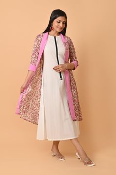 Crafted with the finest Indian cotton, this exquisite dress is a celebration of traditional craftsmanship and contemporary style. Each intricate block print design is a testament to the rich heritage of Indian textiles, specifically hailing from the colorful region of Rajasthan. The lightweight and breathable cotton fabric make this dress a perfect choice for warm summer days, ensuring both comfort and style in one elegant piece. The Jaipuri print adorning the dress brings alive the vibrant colors and floral patterns that are characteristic of this culturally rich region. This stunning cotton dress is more than just clothing; it's a statement piece that bridges the gap between tradition and modern fashion. Whether you're looking for a standout ensemble to gift your girlfriend, mom, sister, Transitional White Cotton Dress, Spring Chanderi Block Print Dupatta, Designer Cotton Dresses With Printed Motifs, Cotton Dresses With Printed Motifs For Designer Wear, Multicolor Cotton Designer Dress, Chanderi Long Sleeve Block Print Dresses, Designer Pink Cotton Dresses, Pink Cotton Cutdana Dress, Pink Cotton Dress With Cutdana Detailing