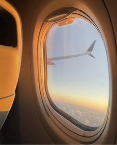 an airplane window looking out at the sky