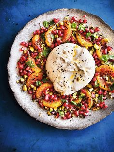 a white plate topped with food on top of a blue table