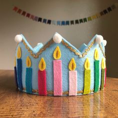 a birthday cake with candles on it sitting on a table