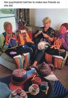 two women sitting on a couch with knitted items in front of them and one woman knitting