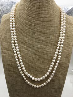 "pearl jewelry: long pearl necklace quantity: 1 pc necklace length: 34 inches or 51 inches pearl body: AA+ pearl grade: AA+ pearl luster:high pearl shape: near round pearl size: around 7mm pearl colour: white Back to Other Jewelry Section 01: \"Tahitian,Akoya,Sea Pearl\" Section: https://www.etsy.com/shop/WenPearls?section_id=15806339 02: \"Potato/Near Round Pearl\" Section: https://www.etsy.com/shop/WenPearls?section_id=16378067 03: \"Round Pearl\" Section: https://www.etsy.com/shop/WenPearls?s Classic White Long Pearl Necklace, Elegant White Long Necklace With Round Beads, Elegant Wedding Necklace With 108 Beads, Pearl White Long Pearl Necklace In Elegant Style, Long Pearl Necklace With Round Beads, White Pearl Long Necklace For Formal Occasions, Classic Long Pearl Necklace, Elegant Pearl White Long Pearl Necklace, Elegant Pearl White Long Necklace