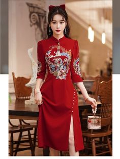 "⭐⭐ This Dress is stunning for Brides who wants to have a traditional Chinese Wedding celebration. Vivid Wine Red with Classical Chinese Embroidery Flowers Art and Tassels 囍, Stands for Joy and Happiness for the bride and groom. ⭐ Size Chart by Centimetre/ CM: Bust / Waist XS : 77CM/ 63CM; S: 83CM/ 66CM ; M : 86CM/ 70 CM; L: 90 CM/73 CM; XL: 93CM/ 76 CM; XXL: 96CM/ 80CM; 3XL: 99CM/ 83CM; Or Custom Size Available. ⭐ Three Dress Length Option: To Knee( About 100cm) To Mid-Calf (about 120cm); Full Elegant Embroidered Festive Cheongsam, Elegant Red Dresses For Festivals, Ceremonial Dresses With Floral Embroidery, Traditional Embroidered Cheongsam For Wedding, Traditional Long Sleeve Red Gown, Ceremonial Fitted Dress With Floral Embroidery, Traditional Red Long Sleeve Gown, Elegant Fitted Embroidered Dress For Traditional Ceremonies, Ceremonial Fitted Floral Embroidery Dress