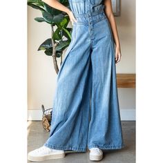 Medium washed denim jumpsuit featuring collared neck and snap button closure. Sleeveless, cargo chest pockets, ruched waist back, back pockets, extra wide leg pant. This jumpsuit is long and tends to run small. We recommend sizing up one size. Handwash Cold 95% Cotton 5% Polyester Model is 5'7" and wearing size Small Extra Wide Leg Pants, Maxi Romper, Crop Top Sweatshirt, Wide Leg Pant, Denim Button Down, Girl Coat, Washed Denim, Wide Pants, Midi Maxi Dress