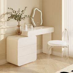 a white dressing table with a mirror and stool