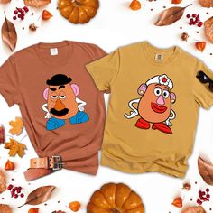 "Mr Potato and Ms Potato Heads Inspired Couples Matching Shirt, Mr Potato and Ms Potato Head Shirt, Thanksgiving Couple,Cute Thanksgiving Tee 📢Please Check All Photos For Details.   📢Choose Your T-Shirt Size From The Drop-Down Lists Next To The item Picture   📢Choose Of Your T-Shirt Color From The 2nd Picture   📢Use \"Add message to Seller\" link On The Checkout Page To Send me the Following important Details For Your Order's Customization.   📢Shipping Time Varies by location (we are located in Sugar Land, Texas) please consider that our turn around time is 1 to 3 business days.   📢 ⭐Which brand do you use for t-shirts? We use Soft style Gildan, Bella Canvas Unisex, Rustic United, Comfort Color, Hanes, District, Outlash, Tees and Next Level when we have a shortage of stocks for certa Mr Potato Head Tshirt, Brown Cotton Tops With Cartoon Print, Brown Cotton Top With Cartoon Print, Ms Potato Head, Mr Potato, Thanksgiving Tee, Couple Cute, Potato Heads, Potato Head