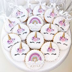 decorated cookies in the shape of unicorns and rainbows