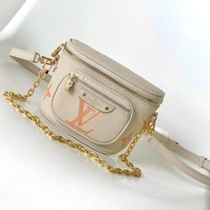 Mini Bumbag handbag from the LV Gradient series, which renders the gradient midsummer color for the Monogram embossing of Monogram Empreinte leather. The on-trend shape features a zipped main compartment, and a Louis Vuitton leather label accents the front pocket. Clever use of the detachable chain and detachable and adjustable shoulder strap, the shoulder and crossbody can be converted at will.

Size: 17.0 x 12.0 x 9.5 cm (LxHxW)
• Monogram Empreinte embossed soft-grain calfskin
• Textile l Luxury Belt Bag With Zipper Pocket, Luxury Rectangular Belt Bag With Zipper Pocket, Luxury Beige Bags With Zipper Pocket, Luxury Beige Belt Bag For Travel, Luxury White Bags With Zipper Pocket, Luxury White Bag With Zipper Pocket, Luxury Beige Shoulder Bag With Zipper Pocket, Luxury Beige Belt Bag With Removable Pouch, Louis Vuitton Yayoi Kusama