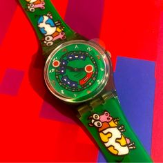 Unused Albin Christen 2000 Swatch Rare Find Crazy Train Gent Watch With Protective Watch Face Plastic Film Still On! Cartoon Cows And Train Tracks. Currently Not Running But Bringing To Swatch Soon To Test. New In Box. Water Resistant. Multicolor Analog Watches For Gift, Multicolor Analog Watches As Gift, Gift Multicolor Analog Watches, Green Analog Watch As A Gift, Modern Green Watches For Gift, Cartoon Cows, Funny Watch, Box Water, Cartoon Cow