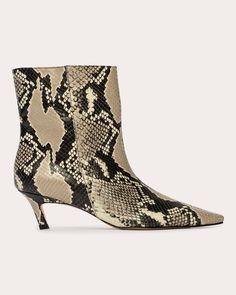 Edgy in form, the Avenue bootie exudes angular appeal with its pointed toe and slanted kitten heel. The snake-embossed leather construction creates a textured effect. Pull-on Pointed toe Angled kitten heel Snake-embossed Upper: 100% leather Lining: 100% leather Sock: 100% leather Outsole: 100% leather Spot clean Handmade in Brazil Size & Fit Heel height: 1.96in (50mm) Shaft height: 5.9in Fits true to size Snake Leather, Leather Socks, Kitten Heel, Leather Ankle Boots, Embossed Leather, Black Suede, Bootie, Kitten Heels, Brazil