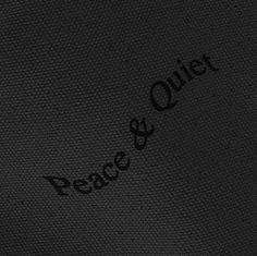 the word peace is written in black ink