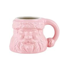 a pink mug with a face on it