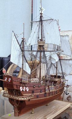 a model ship is sitting on a table