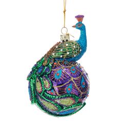 a glass ornament with a peacock on it