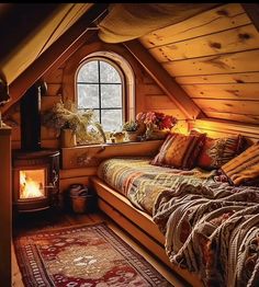 an attic bedroom with a bed and fireplace