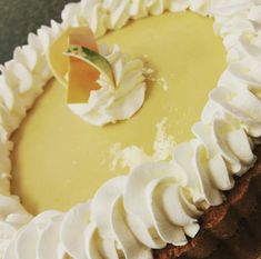 a lemon pie with whipped cream on top