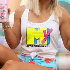 This retro throwback 40th birthday racerback tank top is perfect for your 80's workout neon spandex or music themed 40th birthday party! It's printed just for you on a buttery soft top, so no decals will be peeling off in the wash. *These run fitted - if you want any roominess or a relaxed fit consider sizing up* Matching tshirts sold here: https://prismandpoppy.etsy.com/listing/1490608201/40th-birthday-shirt-for-80s-theme-40th Matching coozies sold here: https://prismandpoppy.etsy.com/listing/1 1980s 40th Birthday Party, 90s Summer Birthday Tops, 90s Style Summer Birthday Tops, 90s Summer Tops For Birthday, Retro Stretch Tank Top With Graphic Print, Fitted Fun Tank Top, 40th Birthday Outfits For Women, 40th Birthday Ideas For Women Themes, 40th Birthday Party Themes