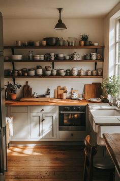 Serene Japandi kitchen design showcasing neutral palette, functional layout, and inviting book nook Japandi Style Kitchen, Light Gray Cabinets