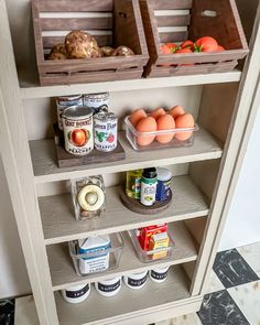 an organized pantry with eggs, yogurt, and other food items on shelves