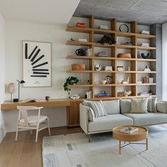 a living room filled with furniture and bookshelves