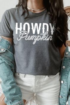 Howdy Pumpkin Graphic Tee. Unisex Crew Neck 100%COTTON HEATHER(52%COTTON,48%POLY) ATH.HEATHER,BLACK HEATHER(90%COTTON,10%POLY) Imported Gray Graphic Tee For Fall, Fitted Gray T-shirt For Fall, Fall Gray Graphic Print T-shirt, Gray Text Print T-shirt For Fall, Gray Graphic Print T-shirt For Fall, Trendy Fall Shirt With Text Print, Fitted Fall Graphic Tee Shirt, Fitted Graphic Tee For Fall, Gray Relaxed Fit T-shirt For Fall