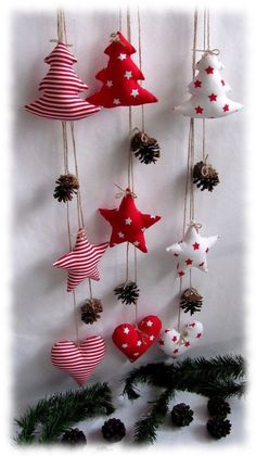 red and white christmas decorations hanging from strings