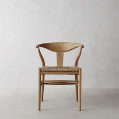 a wooden chair sitting on top of a white floor