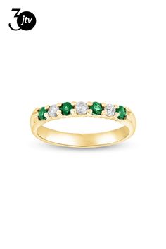 0.35ctw Emerald and Diamond Wedding Band Ring in 14k Yellow Gold. The round emerald in this ring have a total carat weight of 0.20 carats. The diamonds have a total carat weight of 0.15 carats. Emerald And Diamond Band, Diamond Band Ring, Gold Band Ring, Wedding Band Ring, Diamond Rings Bands, Diamond Wedding Band, Diamond Band, Gold Band, Diamond Bands