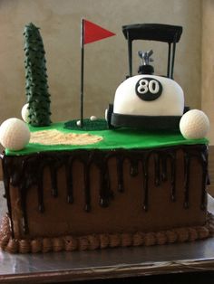 a golf themed birthday cake with chocolate icing and frosting on the top layer