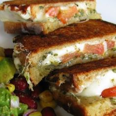 grilled cheese sandwich on toasted bread next to a salad