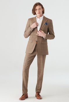 You can never go wrong with neutrals. Creamy off-whites, tans and browns bring a whole new meaning to timeless. This brown suit is a classic color you'll keep around for summers to come. Light Brown Wedding Suit, Timeless Brown Notch Lapel Suit, Timeless Brown Business Suit, Timeless Brown Semi-formal Suits, Timeless Semi-formal Brown Suit, Brown Custom Fit Suits For Formal Occasions, Brown Custom Fit Suit For Business Casual, Beige Double Breasted Suit For Business Casual, Custom Fit Brown Suits For Formal Occasions