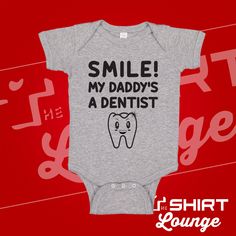 "\"Smile! My Daddy's A Dentist\" Baby Bodysuit makes for a perfect one piece or toddler t-shirt for the son or daughter of a dentist daddy/orthodontist. Feel free to message us with any customization, we are happy to change out names and occupation. Our garments are made from 100% combed ringspun cotton, the one piece includes a lap shoulder neckline, and is reinforced with a three snap closure. This creeper/toddler shirt is sure to put a smile on anyone's face who see its. Spread a little happi Funny Short Sleeve Onesie For Birthdays, Funny Short Sleeve Onesie For Birthday, Funny Short Sleeve Onesie With Name Print, Funny Short Sleeve Onesie With Letter Print, Playful Short Sleeve Onesie With Funny Text, Short Sleeve Onesie With Funny Text For Parenting, Playful Short Sleeve Onesie With Funny Print, Funny Graphic Print Onesie For Playtime, Funny Graphic Print Onesie For Birthday