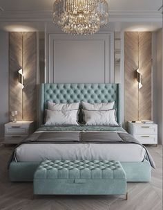 a bedroom with a large bed and chandelier