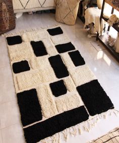 a black and white area rug on the floor