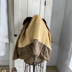 hello and welcome to the Textile Trunk! Please follow us on Instagram, we are @textiletrunk What a wonderful heavy coatA wonderful vintage French men's hunting coat dating c1970's-? The French call them Canadian coats :) ? This coat has faux fur ?? collar and inside it is lined with sheep's wool. It is certain to keep you warm!! The body is brown canvas cotton. This coat is superbly heavy, and ideal for winter use. It has several great pockets externally, and charming wooden buttons. The two lin Vintage Khaki Outerwear For Cold Weather, Vintage Khaki Winter Outerwear, Vintage Khaki Outerwear For Winter, Vintage Beige Outerwear For Outdoor, Vintage Brown Long Coat, Vintage Winter Hunting Outerwear, Vintage Brown Winter Outerwear, Military-style Brown Hunting Outerwear, Brown Military Style Hunting Outerwear