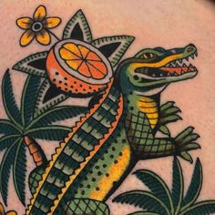 an image of a lizard with oranges on it's back tattoo designs for women